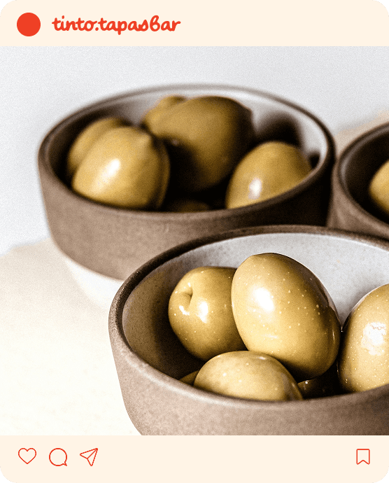 Instagram-post met potjes olijven.